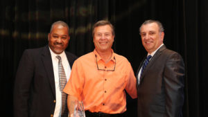 James Willard (center) accepts the award on behalf of Shutts & Bowen. Jim is pictured with Orlando Sentinel Publisher & Editor-In-Chief Avido Khahaifa and Orlando Sentinel Vice President of Advertising John D’Orlando. (Photo credit: Ricardo Ramirez Buxeda, Orlando Sentinel)